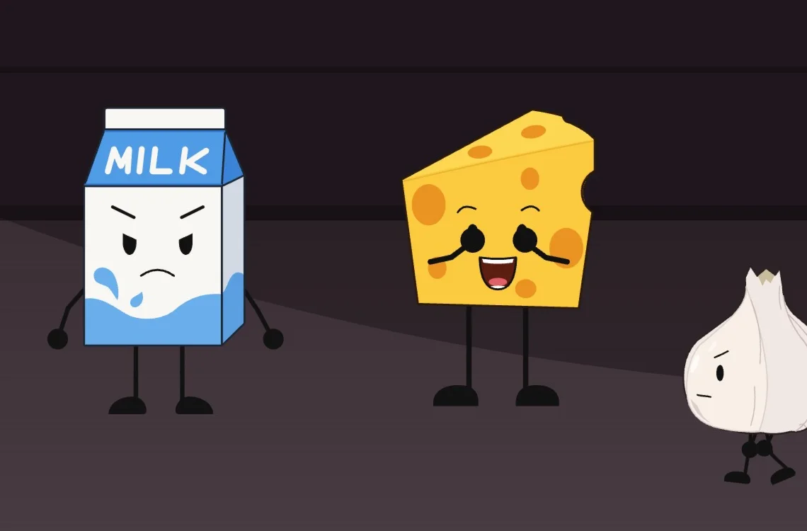 Milk, Cheese and Garlic on a kitchen counter; the cheese has its mouth open mid-word